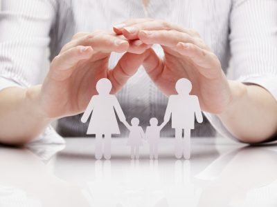 Hands hug the family (concept)